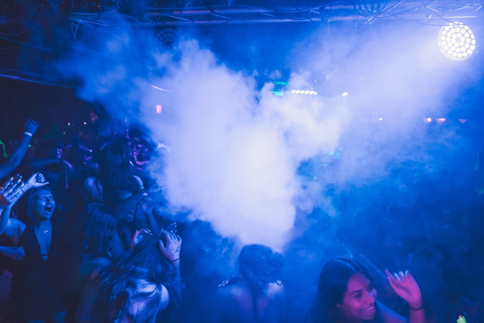 Blue lighting and atmospheric effects over a campus crowd